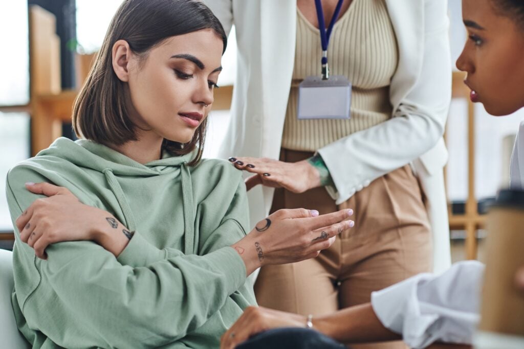teenage girl speaking with mental health counselor or therapist
