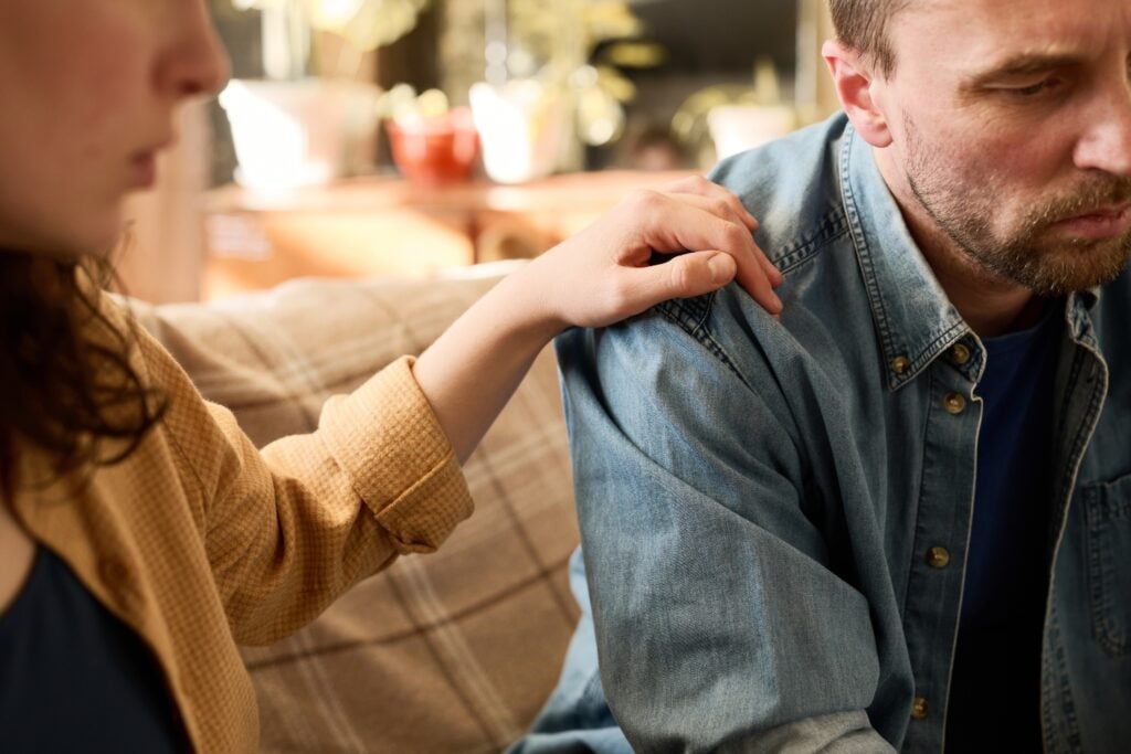 woman and man talking seriously, looking depressed, anxious, irritated, concept of resentment